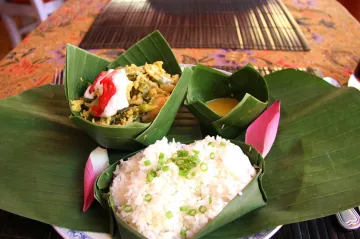 Fish amok (steamed coconut fish in banana leaves)